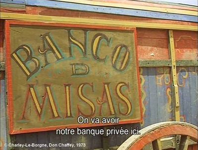   Charley-Le-Borgne  de Don Chaffey.     Photogramme 78. La pancarte : “Banco D Misas”, clouée sur le côté du chariot des mexicains.